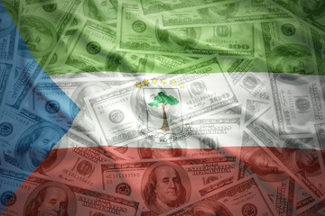 colorful waving equatorial guinea flag on a american dollar money background