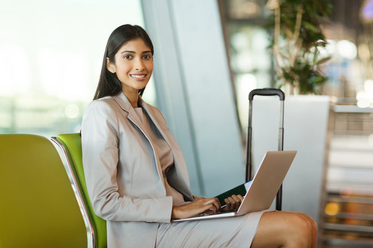 Young Indian Woman Waiting At Airport Lounge