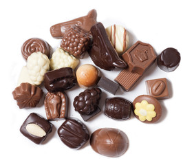 various chocolates on white background - sweet food