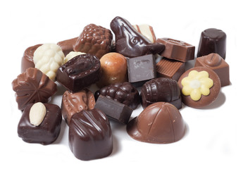 various chocolates on white background - sweet food