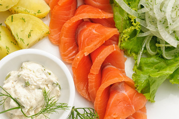 Smocked salmon with mayonnaise and boiled potatoes isolated on white.