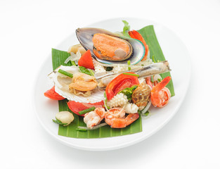 Seafood cocktail with mussels and shrimps isolated on white.