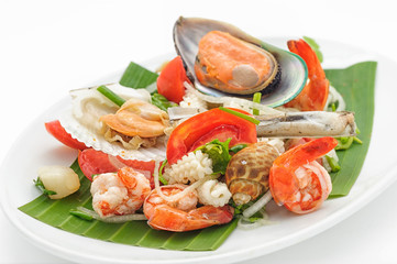 Seafood cocktail with mussels and shrimps isolated on white.
