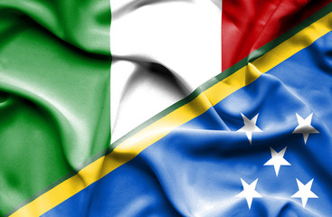 Obraz premium Waving flag of Solomon Islands and Italy