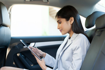 indian business woman using tablet pc
