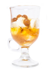 Delicious dessert with banana and caramel isolated on white