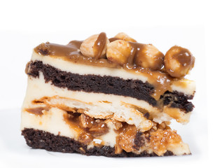 piece of cake with caramel and hazelnut at white