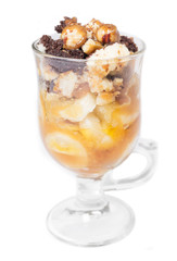 Delicious dessert with banana and caramel isolated on white