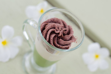 Fototapeta na wymiar Green tea and red bean pudding in a glass