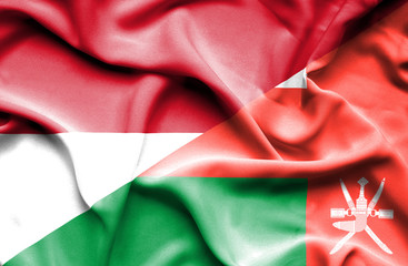 Waving flag of Oman and Monaco