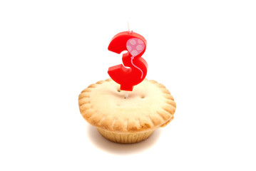 cupcake with three years birthday candle