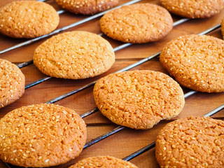 Fresh baked oatmeal cookies on metal cooling rack