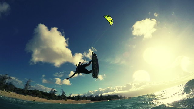 Young Man Kite Boarding in Ocean. Extreme Summer Sport in Slow Motion.