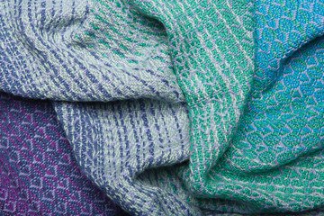 Handmade fabric with green and blue striped texture. Clothes background