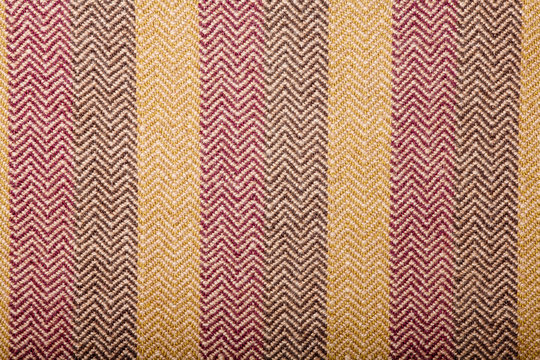 Handmade fabric with brown and gray striped texture. Clothes background