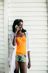 Young african woman with mobile phone