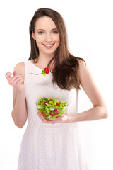 isolated a beautiful girl with salad on white background