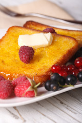 French toast with raspberries and currants close-up. Vertical
