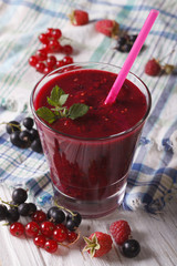 delicious and healthy smoothies with fresh berries closeup. Vertical
