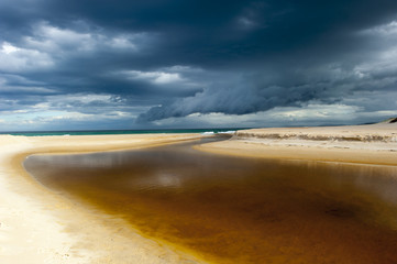 Windy weather storm cloud formation ocean beach