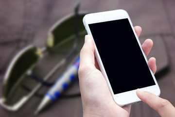 woman hand hold and touch screen smart phone