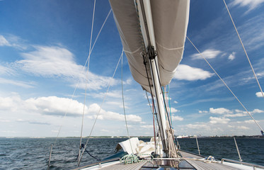 close up of sailboat mast or yacht sailing on sea