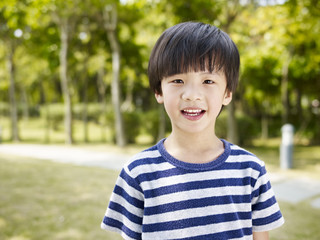 outdoor portrait of a little asian boy