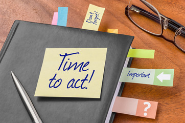 Planner with sticky note - Time to act