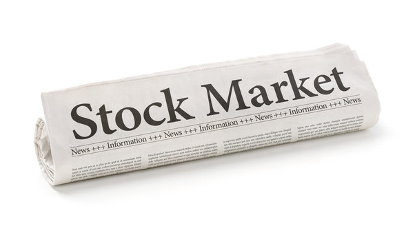 Rolled newspaper with the headline Stock Market