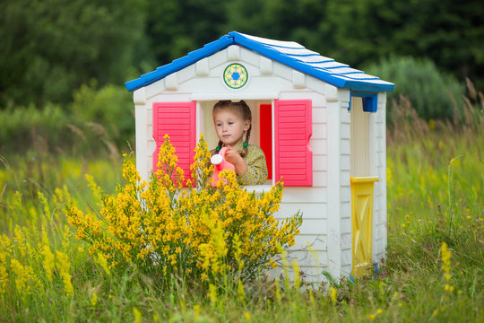 Child In A Toy House