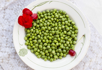 Green peas on the vintage linen background