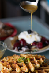 Gourmet breakfast and brunch setting with savory waffles, pancakes