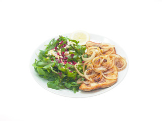 fried turkey fillet with onions, fresh mixed greens and lemon