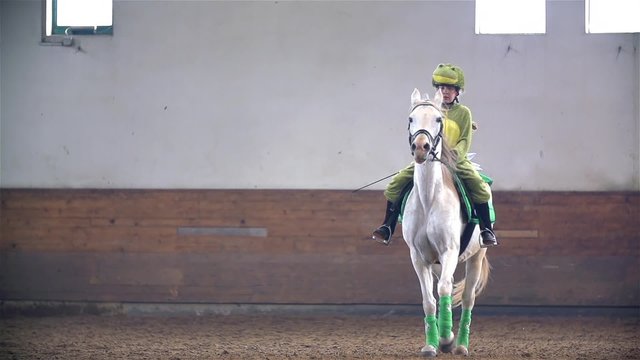 Girl in Frog Costume Riding White Horse Slow Motion