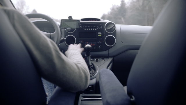 Person driving and gearing view from backseat