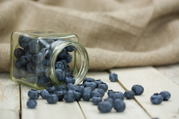 Blueberries spilt from a jar