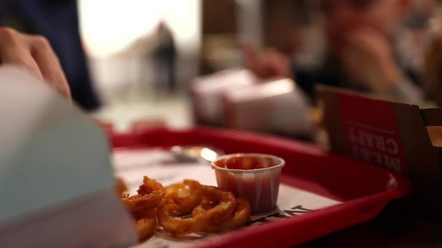 family eating french fries and fast food