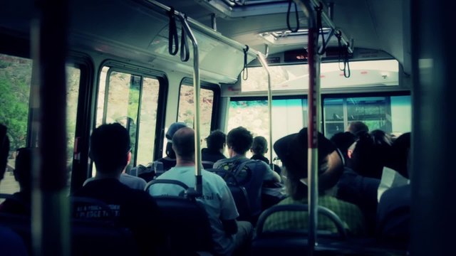 sitting on the shuttle at zion national park