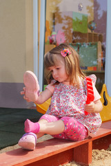 Two-year girl playing and learning in preschool