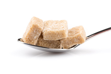 Cubes of sugar on a spoon