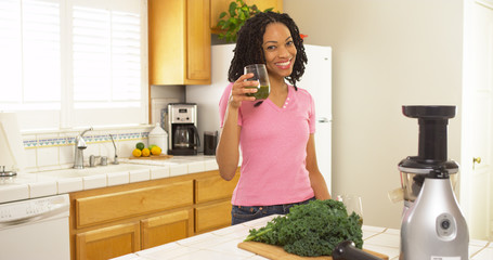 African American woman drinking freshly made juice
