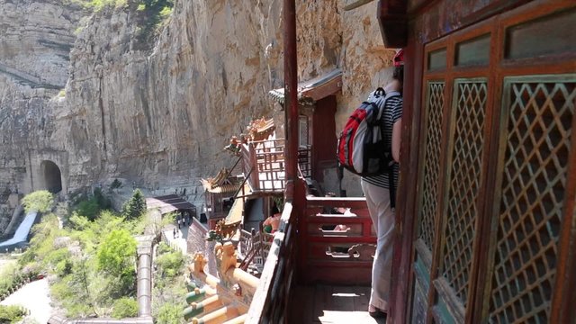 tourist visiting the hanging temple monastery in datong china
