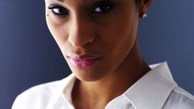 Slow reveal of sultry black woman looking at camera