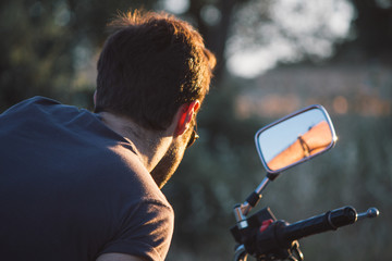 Man looking in the rearview