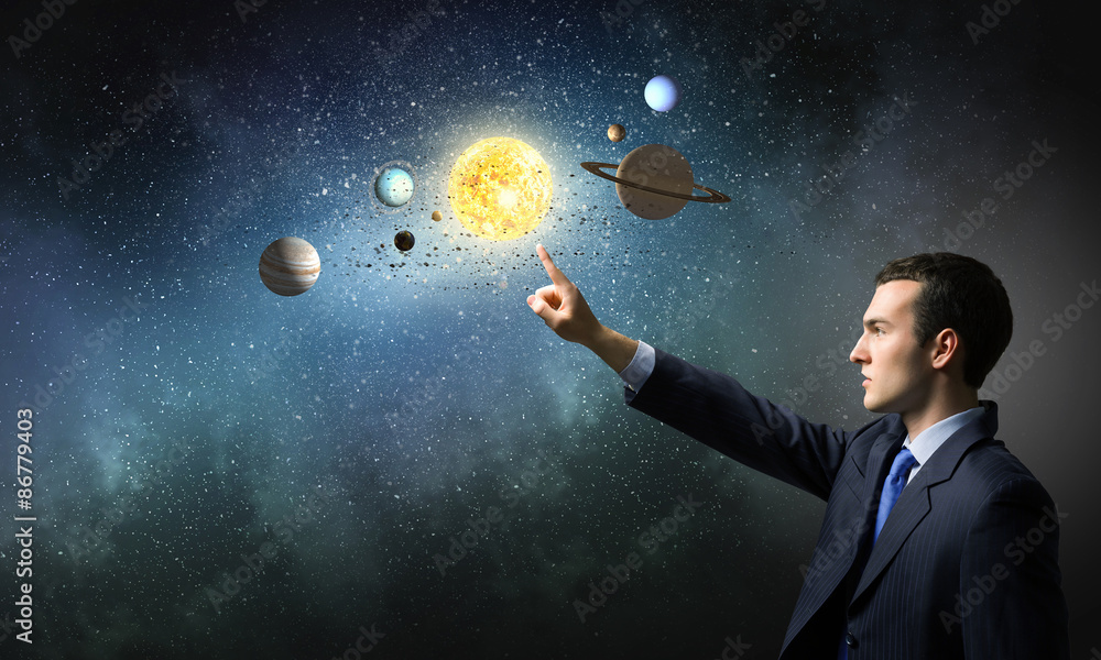 Wall mural man exploring space