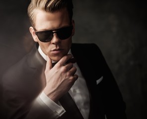 Obraz premium Tough sharp dressed man in black suit