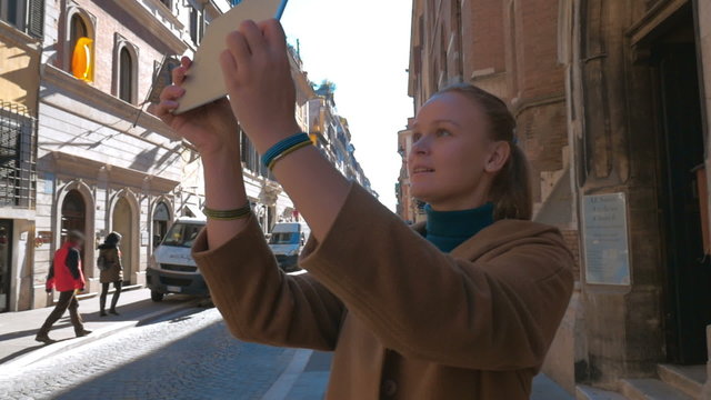 Woman making photos of European architecture