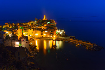 Vernazza town on the coast of Ligurian Sea at dusk, Italy - obrazy, fototapety, plakaty