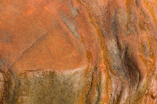Fond en roche mouill&eacute;e couleur chaude le Pouldu Bretagne

