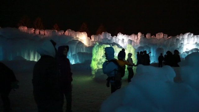 people visiting an ice castle